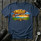 Miles Don't Scare Me! T-shirt by The Riverstone Life on a navy Gildan Softstyle 64000 featuring a colorful open highway and mountain landscape design.