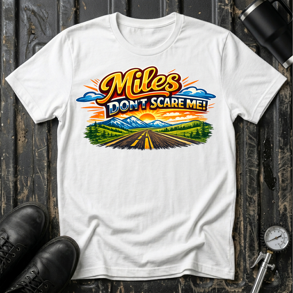 Miles Don't Scare Me! T-shirt by The Riverstone Life on a white Gildan Softstyle 64000 featuring a colorful open highway and mountain landscape design.