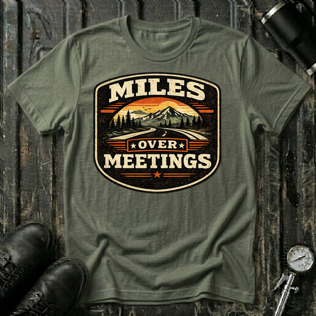Miles Over Meeting T-shirt by The Riverstone Life on a military green Gildan Softstyle 64000 featuring a vintage highway and mountain design.