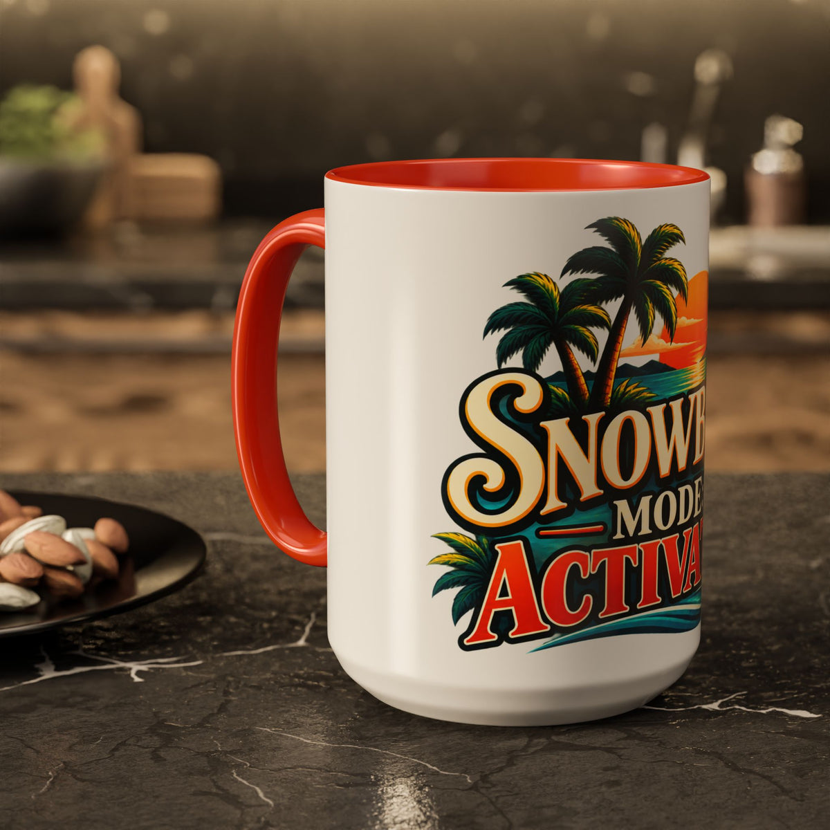 A white ceramic mug with a orange handle and orange interior, featuring a retro-style graphic of palm trees and the text 'Snow Mode Activated' on a dark countertop.