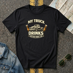 My Truck Drinks Better Than I Do T-shirt by The Riverstone Life on a black Gildan Softstyle 64000 featuring a vintage pickup truck and humorous fuel themed design.