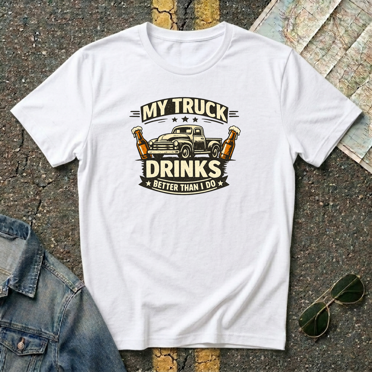 My Truck Drinks Better Than I Do T-shirt by The Riverstone Life on a white Gildan Softstyle 64000 featuring a vintage pickup truck and humorous fuel themed design.