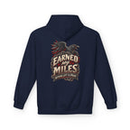 A navy blue hoodie shown from the back, featuring a large graphic print of a raven above the text 'EARNED MY MILES' and 'NOTHING LEFT TO PROVE' in red, beige, and white.