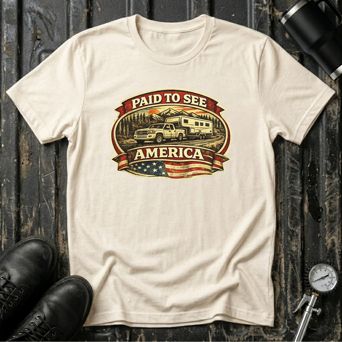Natural RV Transport T-shirt featuring a white pickup truck towing a camper, an America flag, and a phrase "Paid to See America"