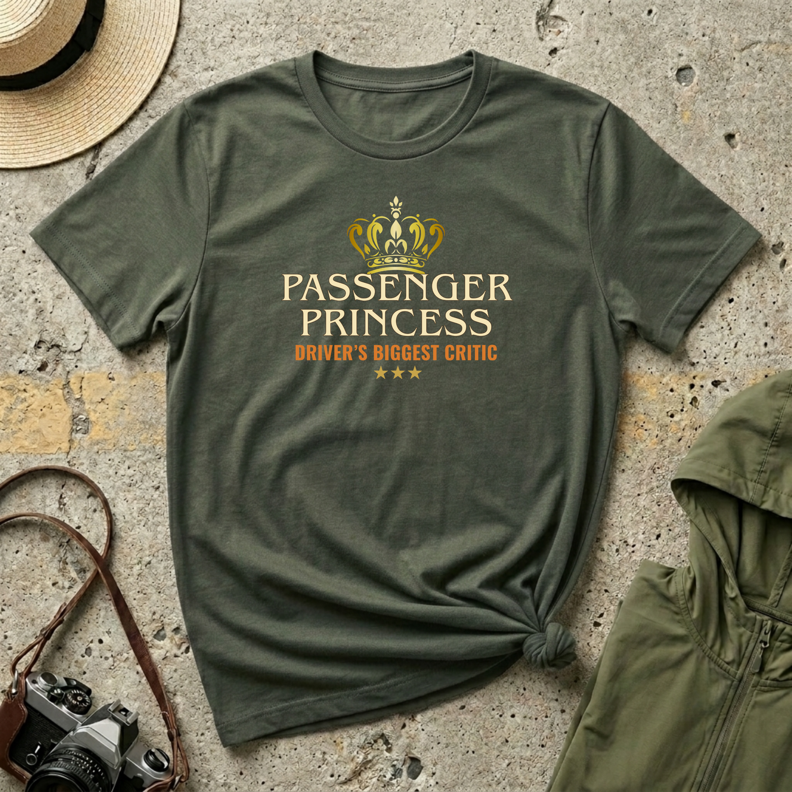 Military green  'Passenger Princess Driver's Biggest Critic' t-shirt featuring a gold crown and vintage inspired typography with three gold stars
