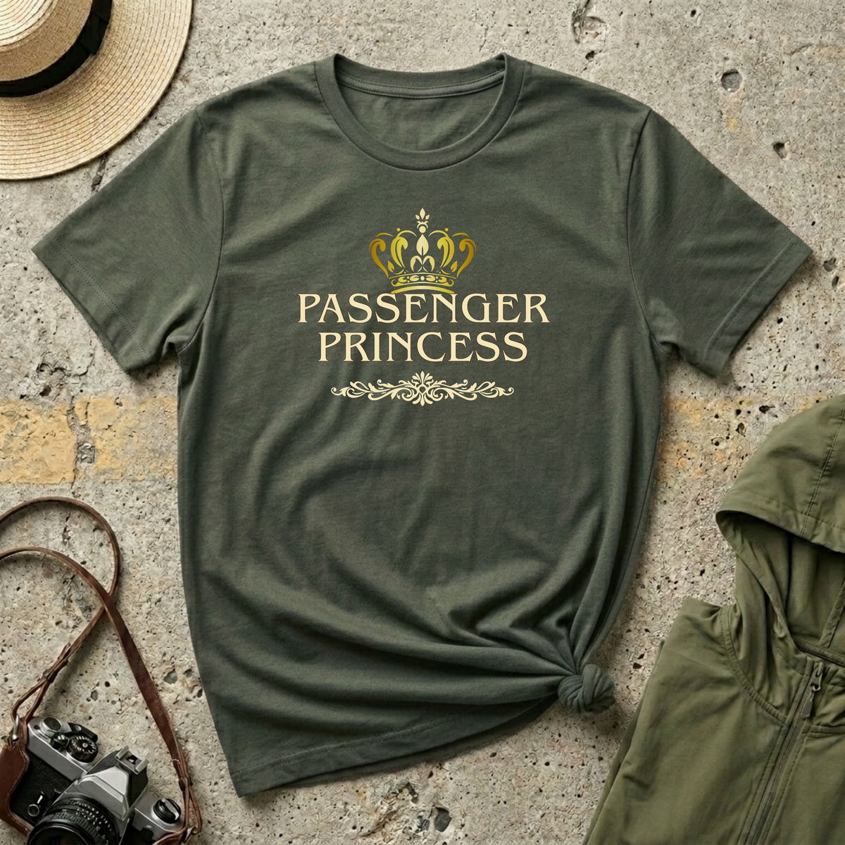 'Passenger Princess' military green T-shirt featuring a gold crown and vintage typography.