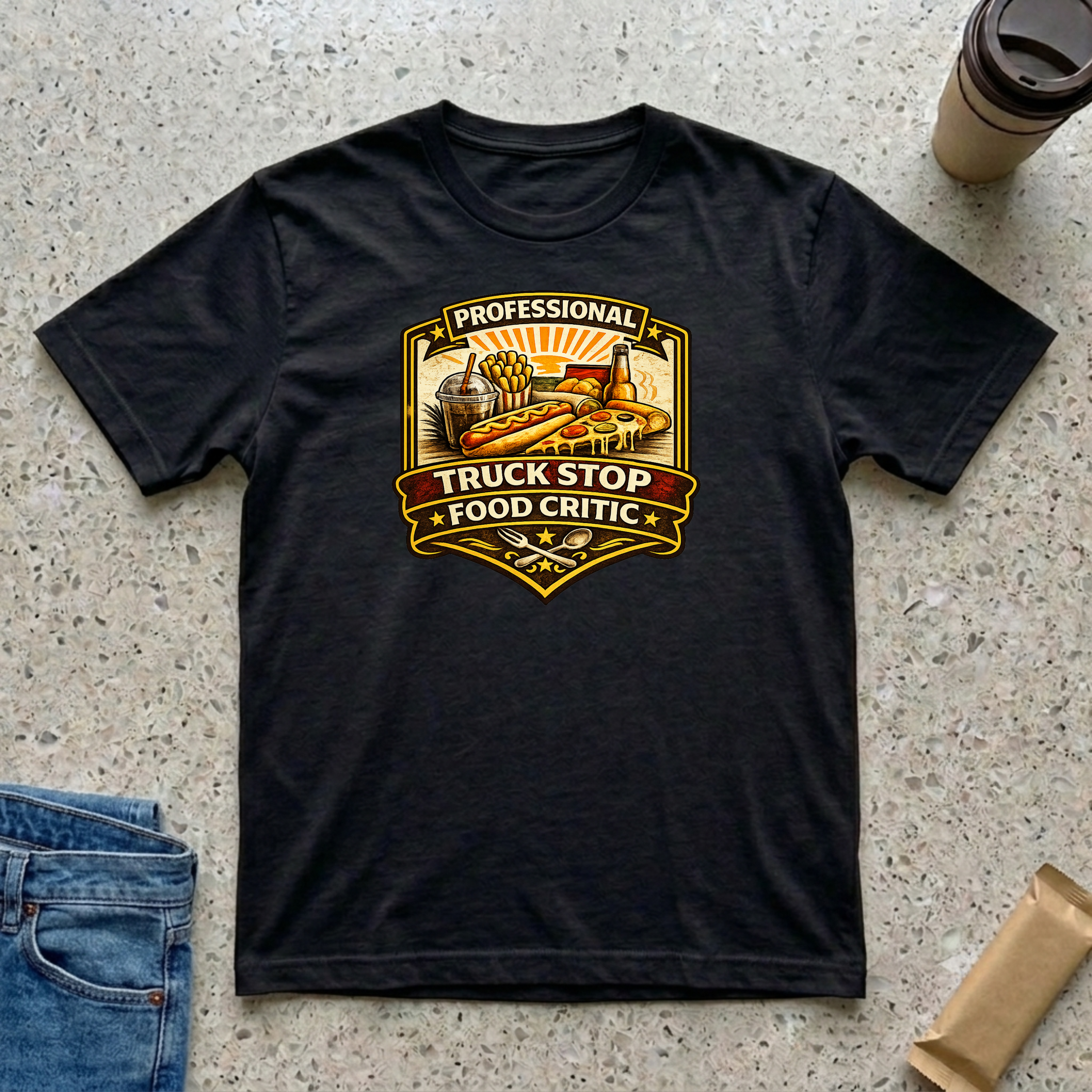 Professional Truck Stop Food Critic T-shirt by The Riverstone Life on a black Gildan Softstyle 64000 featuring a humorous truck stop meal design with classic roadside foods.