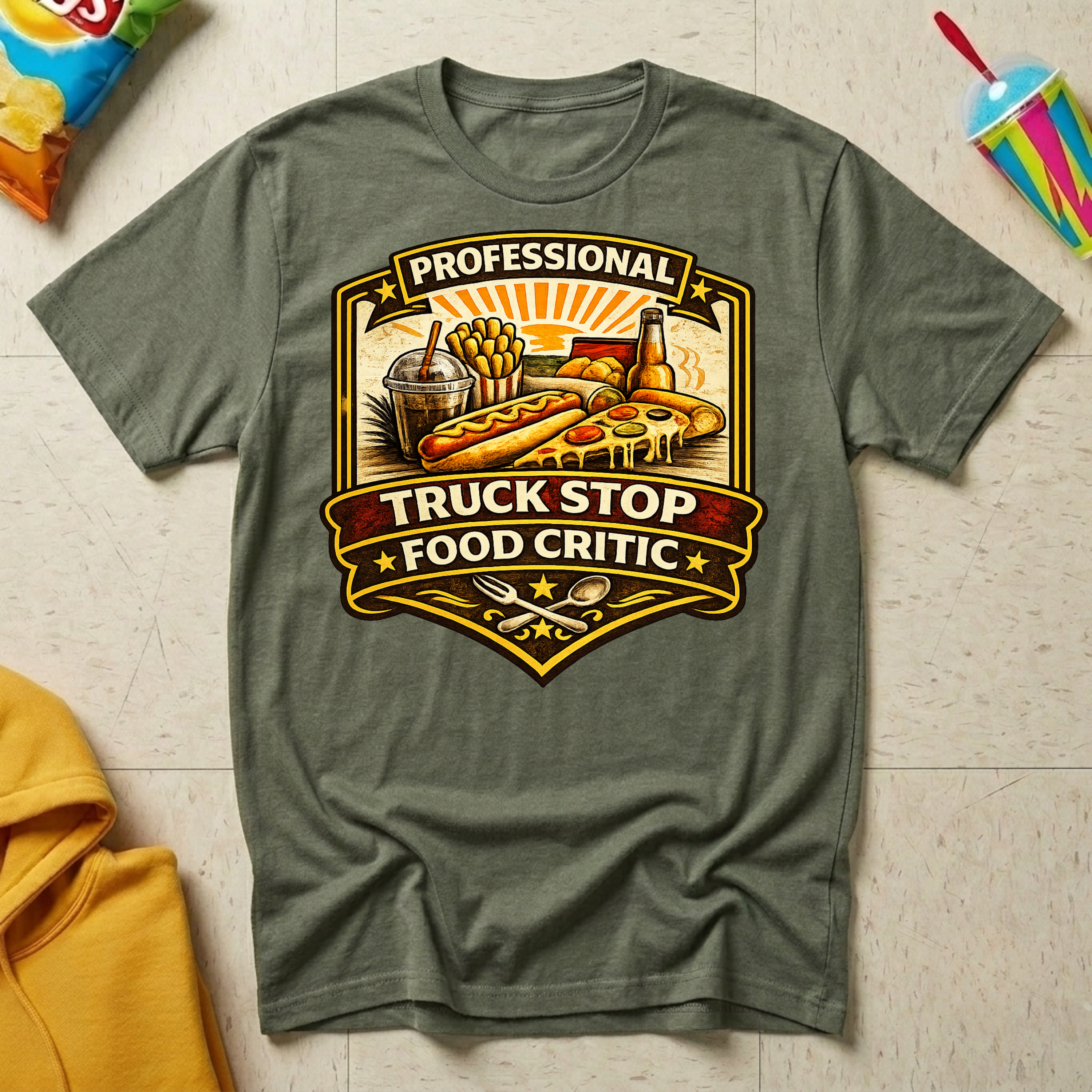 Professional Truck Stop Food Critic T-shirt by The Riverstone Life on a military green Gildan Softstyle 64000 featuring a humorous truck stop meal design with classic roadside foods.