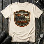 Professional Vacation Delivery Driver dark truck T-shirt by The Riverstone Life on a natural Gildan Softstyle 64000 featuring a pickup truck hauling a fifth-wheel Rv through a mountain landscape.