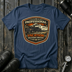 Professional Vacation Delivery Driver dark truck T-shirt by The Riverstone Life on a navy Gildan Softstyle 64000 featuring a pickup truck hauling a fifth-wheel Rv through a mountain landscape.