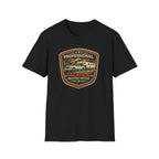 Black RV Transport T-shirt featuring a light pickup truck towing a camper with the phrase "Professional Vacation Delivery Driver" in a vintage badge design on a white background