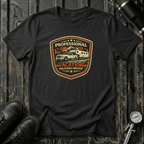 Black RV Transport T-shirt featuring a light pickup truck towing a camper with the phrase "Professional Vacation Delivery Driver" in a vintage badge design.