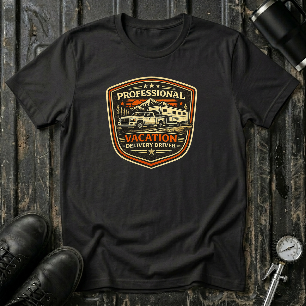 Black RV Transport T-shirt featuring a light pickup truck towing a camper with the phrase "Professional Vacation Delivery Driver" in a vintage badge design.