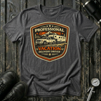 Professional Vacation Delivery Driver light truck T-shirt by The Riverstone Life on a dark heather  Gildan Softstyle 64000 featuring a pickup truck hauling a fifth-wheel RV through a mountain landscape.