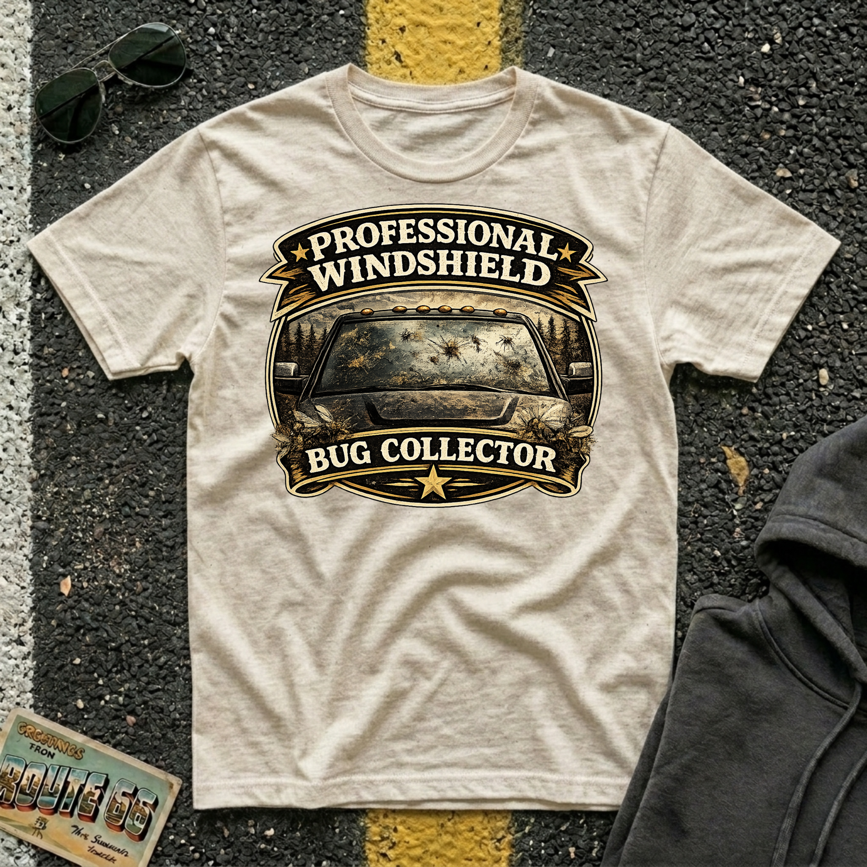Professional Windshield Bug Collector by The Riverstone Life on a natural Gildan Softstyle 64000 featuring a humorious vintage road design with smashed bugs on the truck.