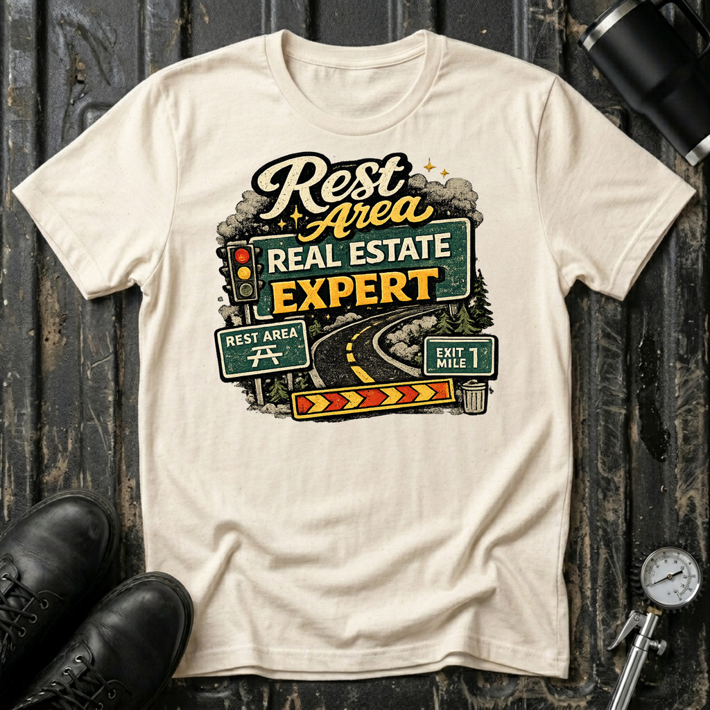 Rest Area Real Estate Expert T-shirt by The Riverstone Life featuring a natural Gildan Softstyle 64000 featuring a humorous highway and rest area design for RV Transport drivers and road travelers.