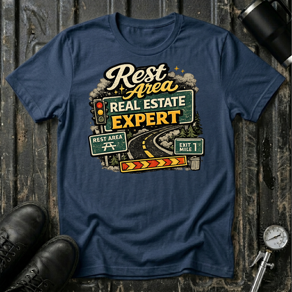Rest Area Real Estate Expert T-shirt by The Riverstone Life featuring a navy Gildan Softstyle 64000 featuring a humorous highway and rest area design for RV Transport drivers and road travelers.