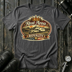 Rest Area Royalty T-shirt by The Riverstone Life on a dark heather Gildan Softstyle 64000 featuring a pickup truck towing an RV at a scenic rest area.