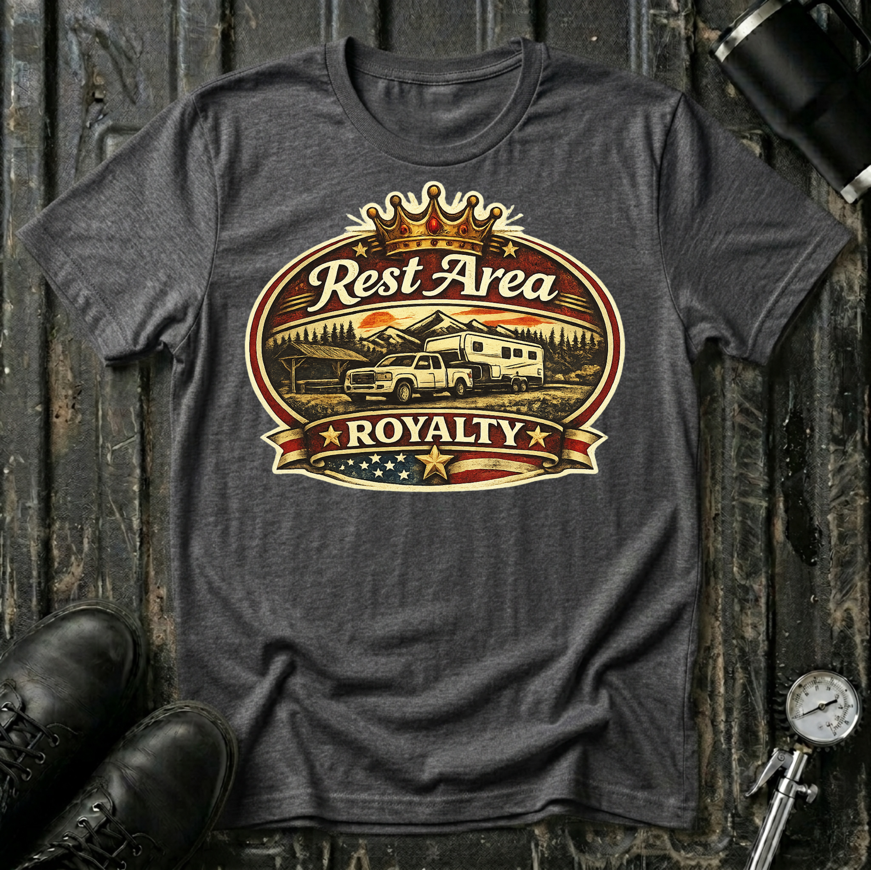 Rest Area Royalty T-shirt by The Riverstone Life on a dark heather Gildan Softstyle 64000 featuring a pickup truck towing an RV at a scenic rest area.