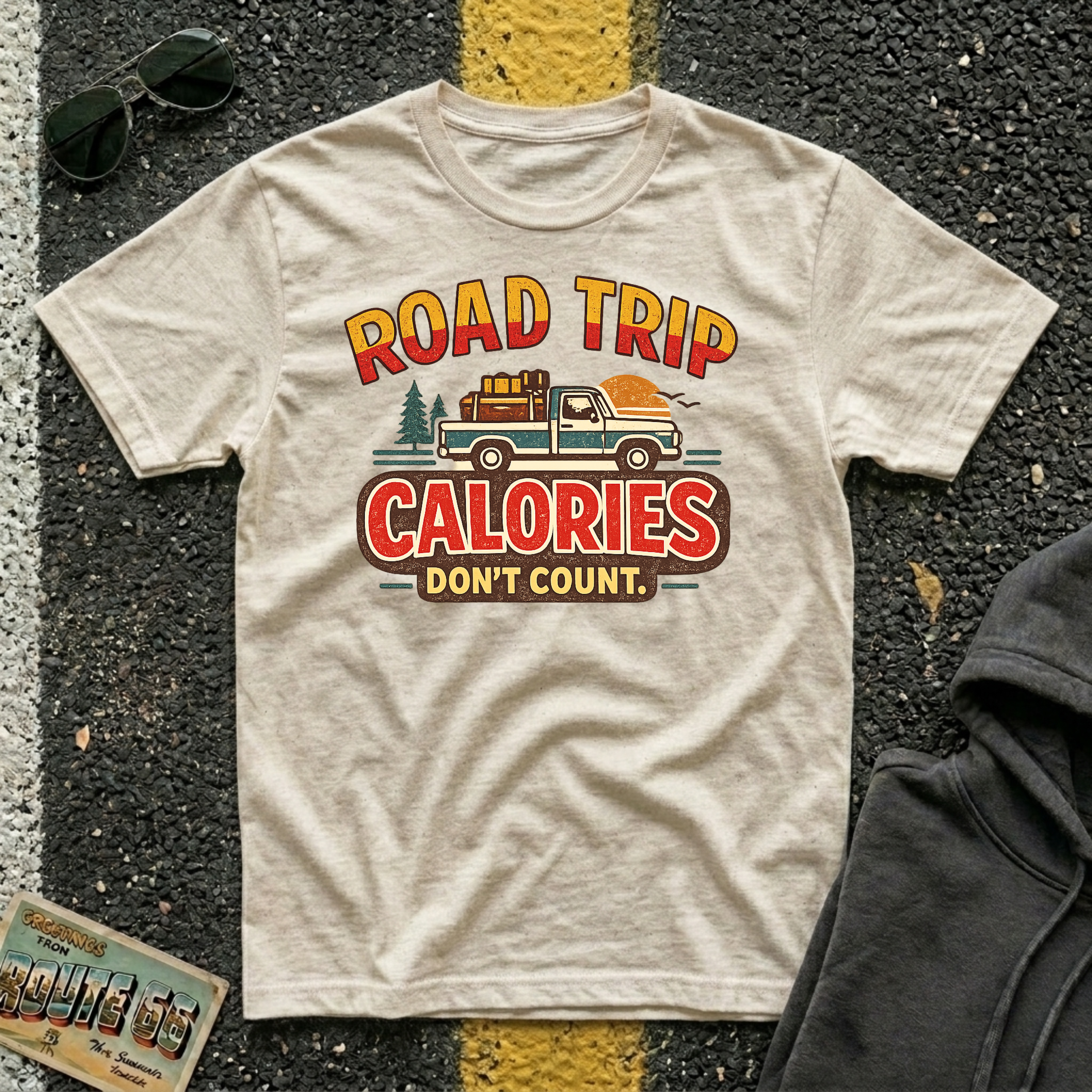 Road Trip Calories Don't Count T-shirt by The Riverstone Life on a natural Gildan Softstyle 64000 featuring vintage road trip design with a pick up truck and luggage in the bed of the truck.