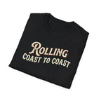 Black folded road life T-shirt featuring the phrase "Rolling Coast to Coast" in a vintage cream and maroon typography