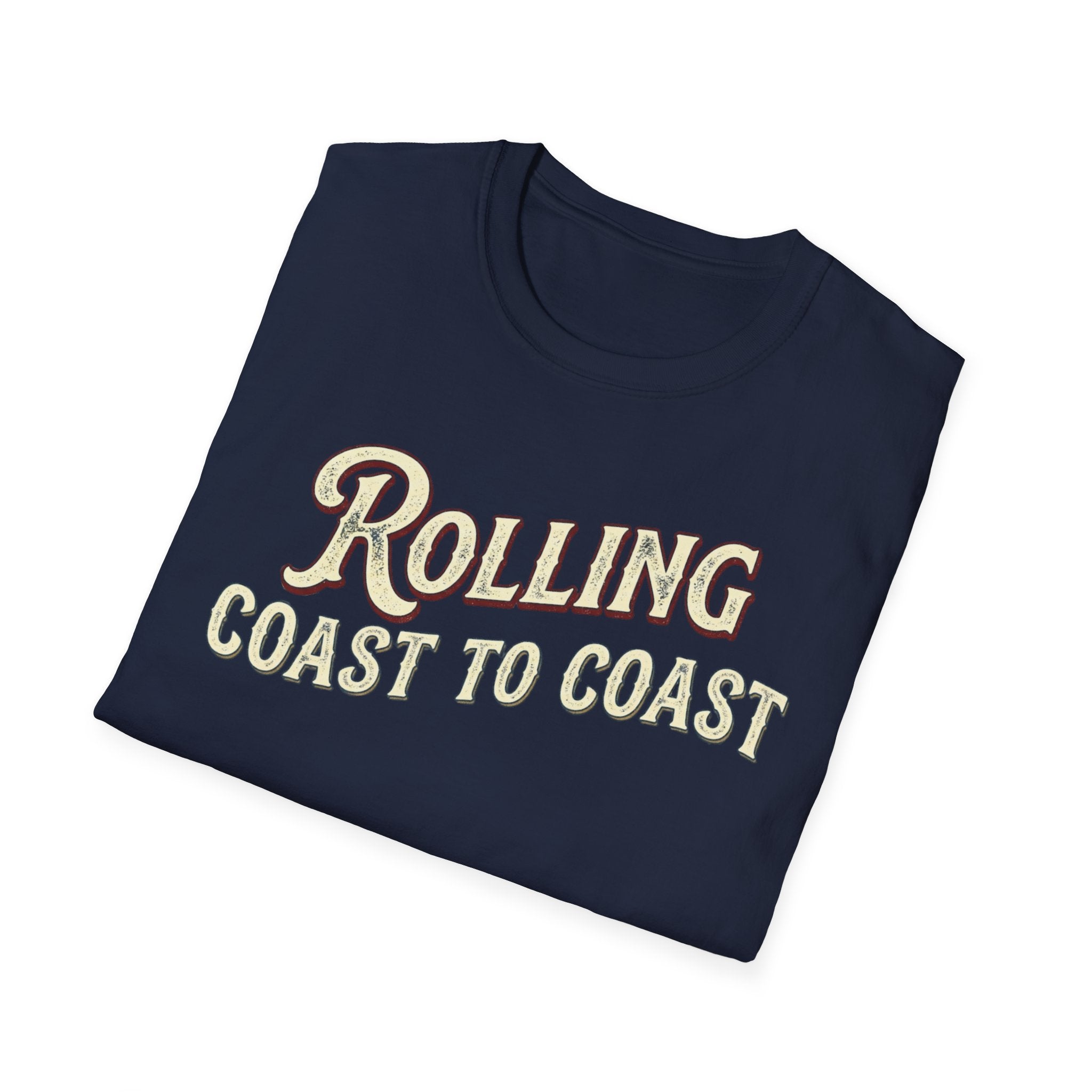 A folded navy t-shirt with the phrase 'ROLLING COAST TO COAST' printed across the front in a cream-colored retro font with a maroon shadow outline, shown on a plain white background.
