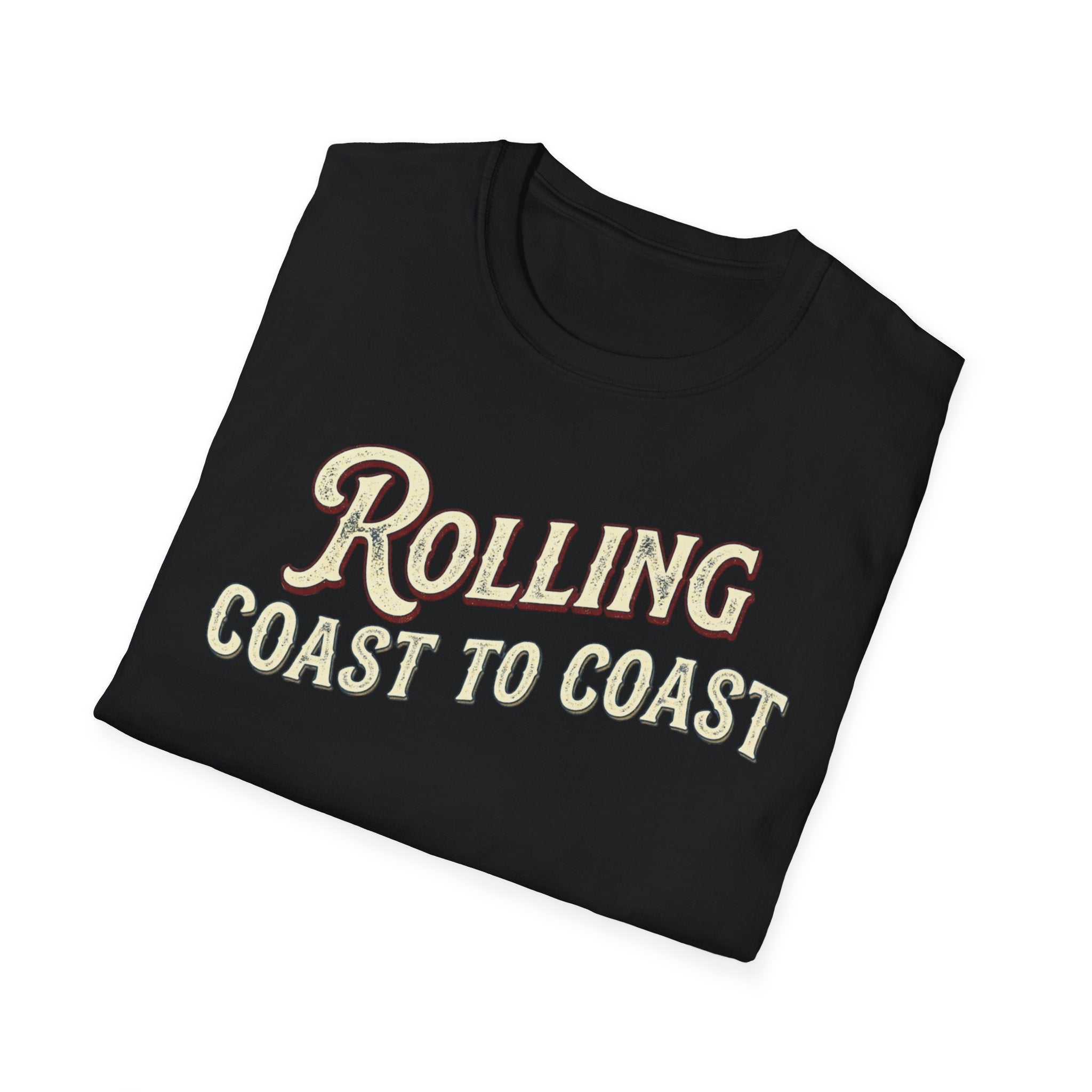 A folded black t-shirt with the phrase 'ROLLING COAST TO COAST' printed across the front in a cream-colored retro font with a maroon shadow outline, shown on a plain white background.