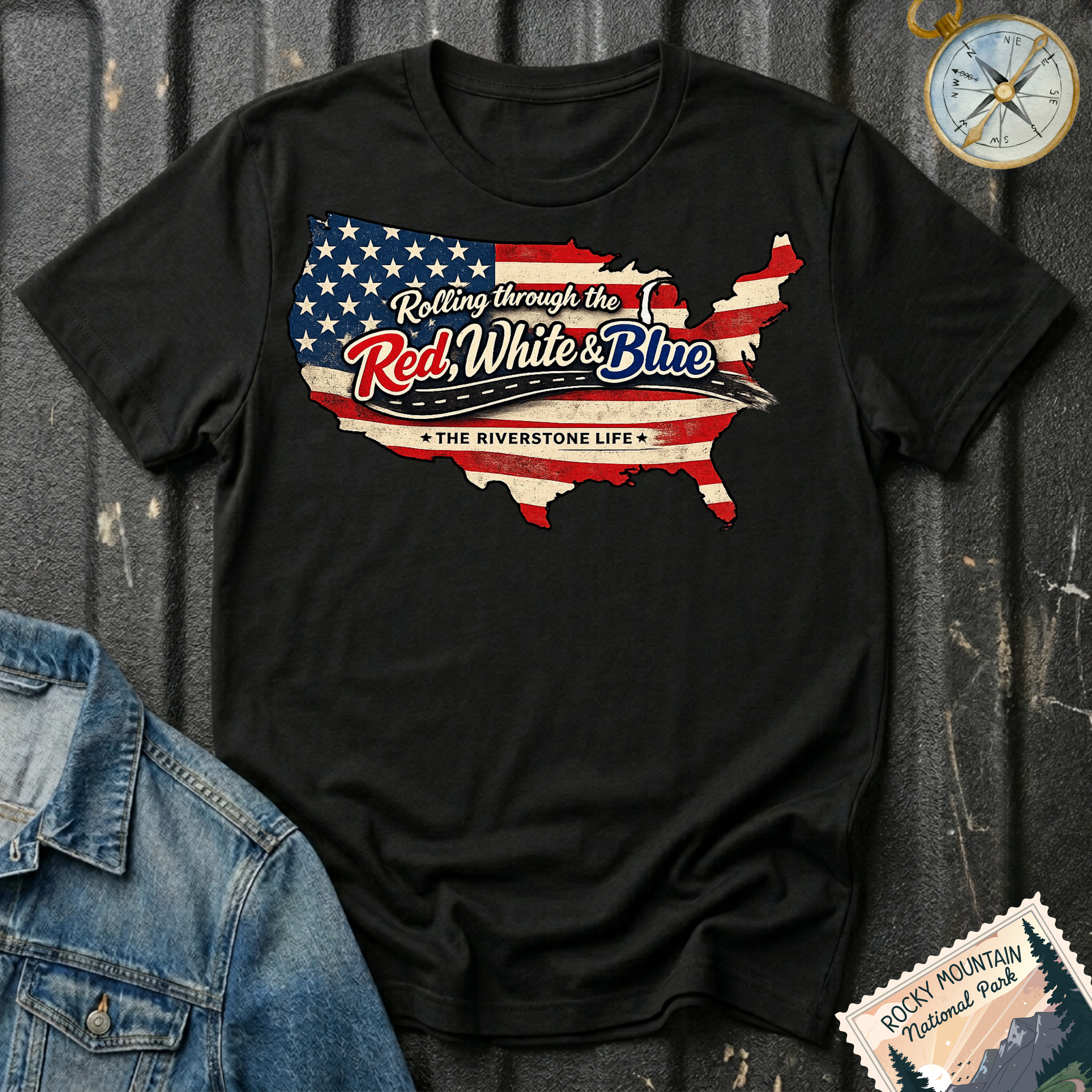 Rolling Through the Red, White & Blue T-shirt by The Riverstone Life on a black Gildan Softstyle 64000 featuring a vintage United States map with patriotic red, white and blue graphics.