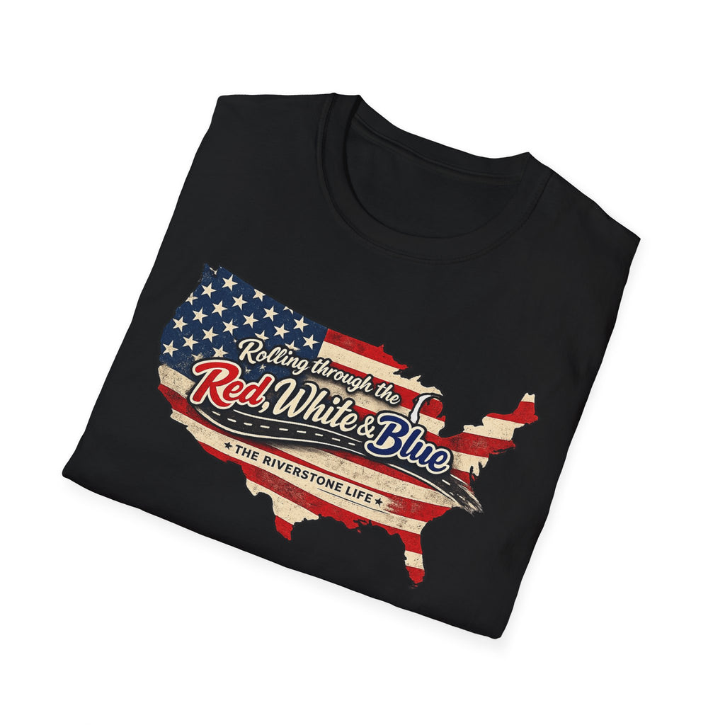 Black folded t-shirt with American flag design and text 'Rolling Through the Red, White and Blue The Riverstone Life' on a white background