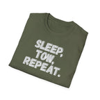 An olive green folded t-shirt with the slogan 'SLEEP, TOW, REPEAT.' printed in a distressed white grayish font on the front, displayed on a clean white background.
