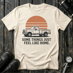 Vintage truck T-shirt featuring the phrase "Some Things Just Feel Like Home" with a retro sunset design for truck lovers and road trip enthusiasts.