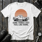 Vintage truck T-shirt featuring the phrase "Some Things Just Feel Like Home" with a retro sunset design for truck lovers and road trip enthusiasts.