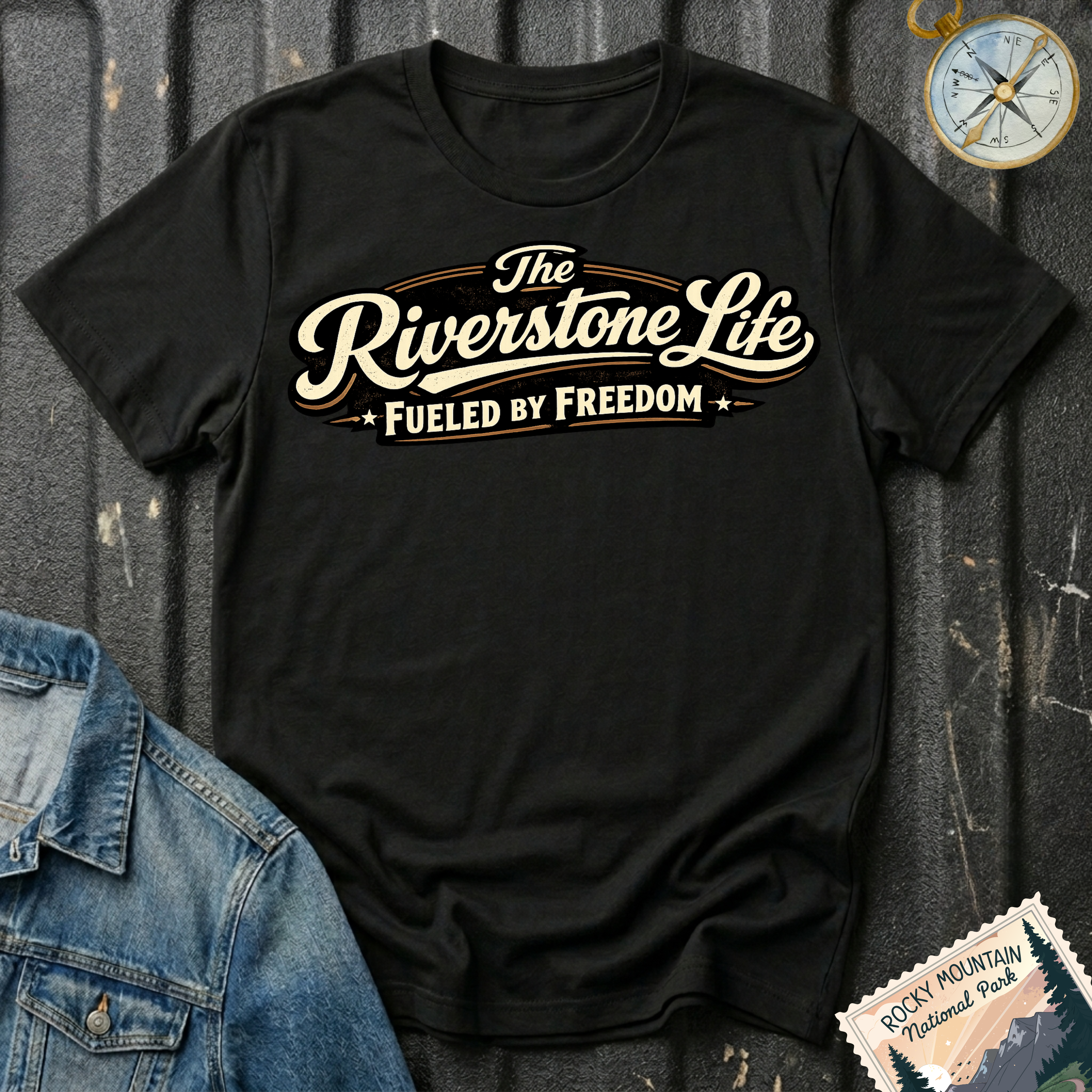 The Riverstone Life–Fueled by Freedom T-shirt on a black Gildan Softstyle 64000 featuring the official The Riverstone Life logo.