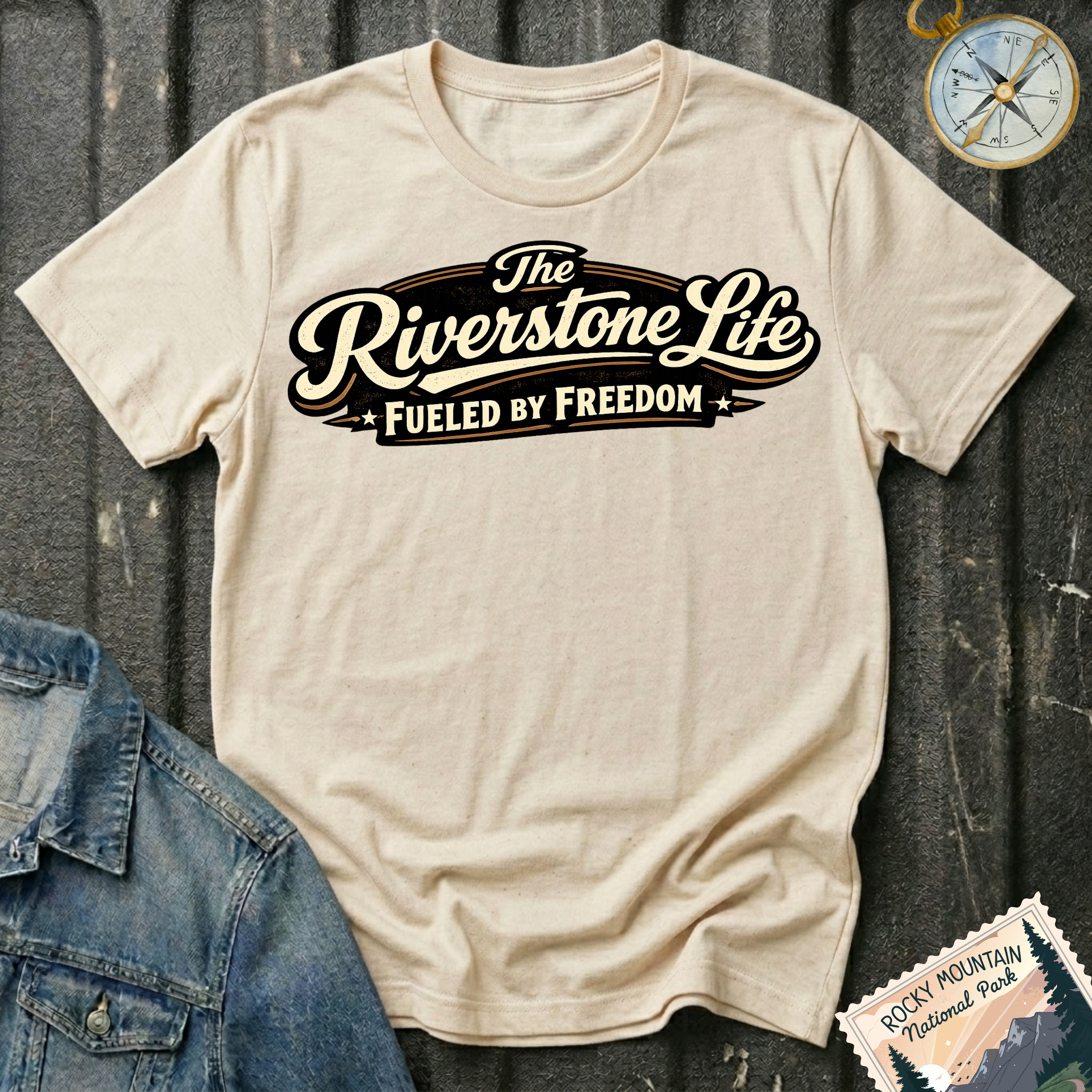 The Riverstone Life–Fueled by Freedom T-shirt on a natural Gildan Softstyle 64000 featuring the official The Riverstone Life logo.
