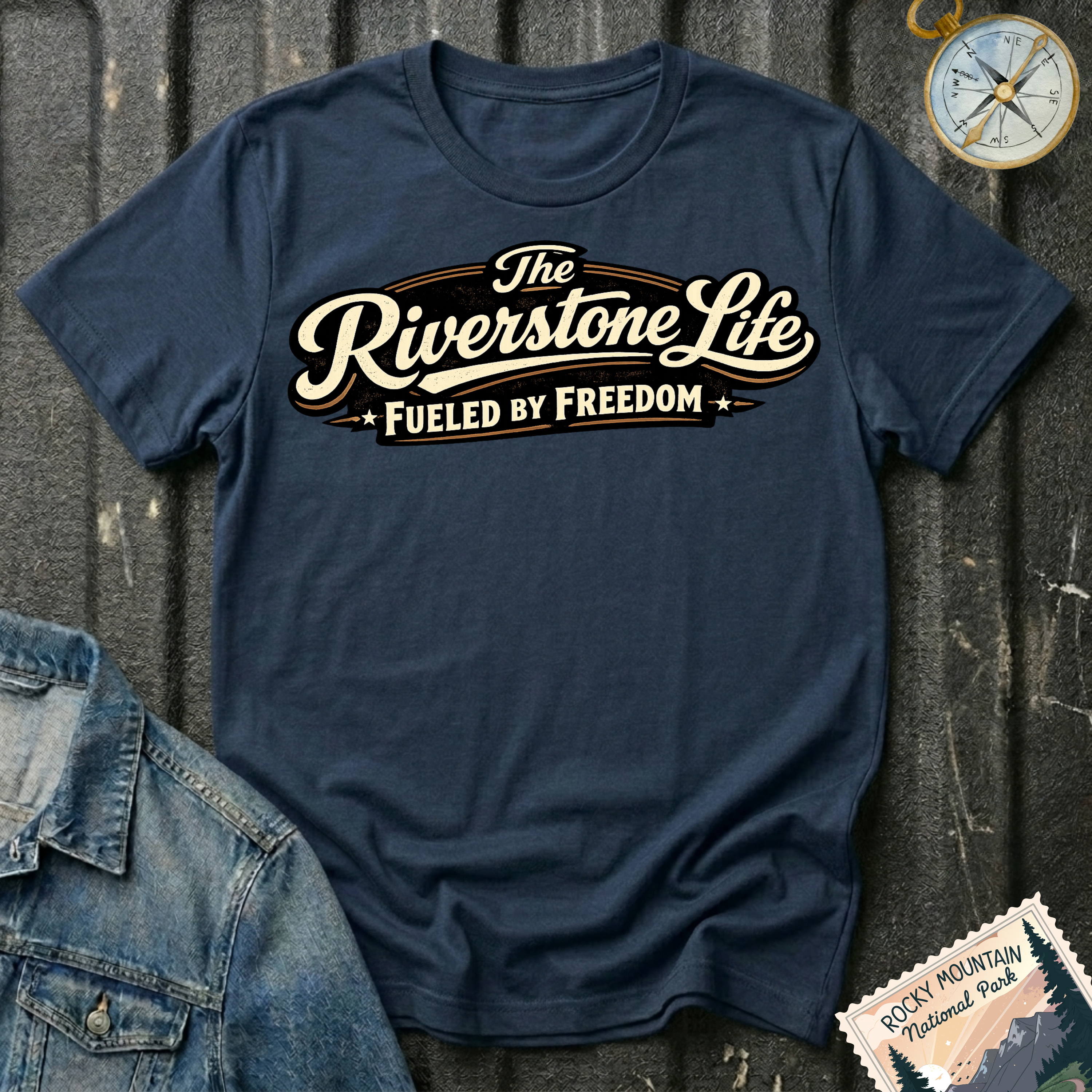 The Riverstone Life–Fueled by Freedom T-shirt on a navy Gildan Softstyle 64000 featuring the official The Riverstone Life logo.