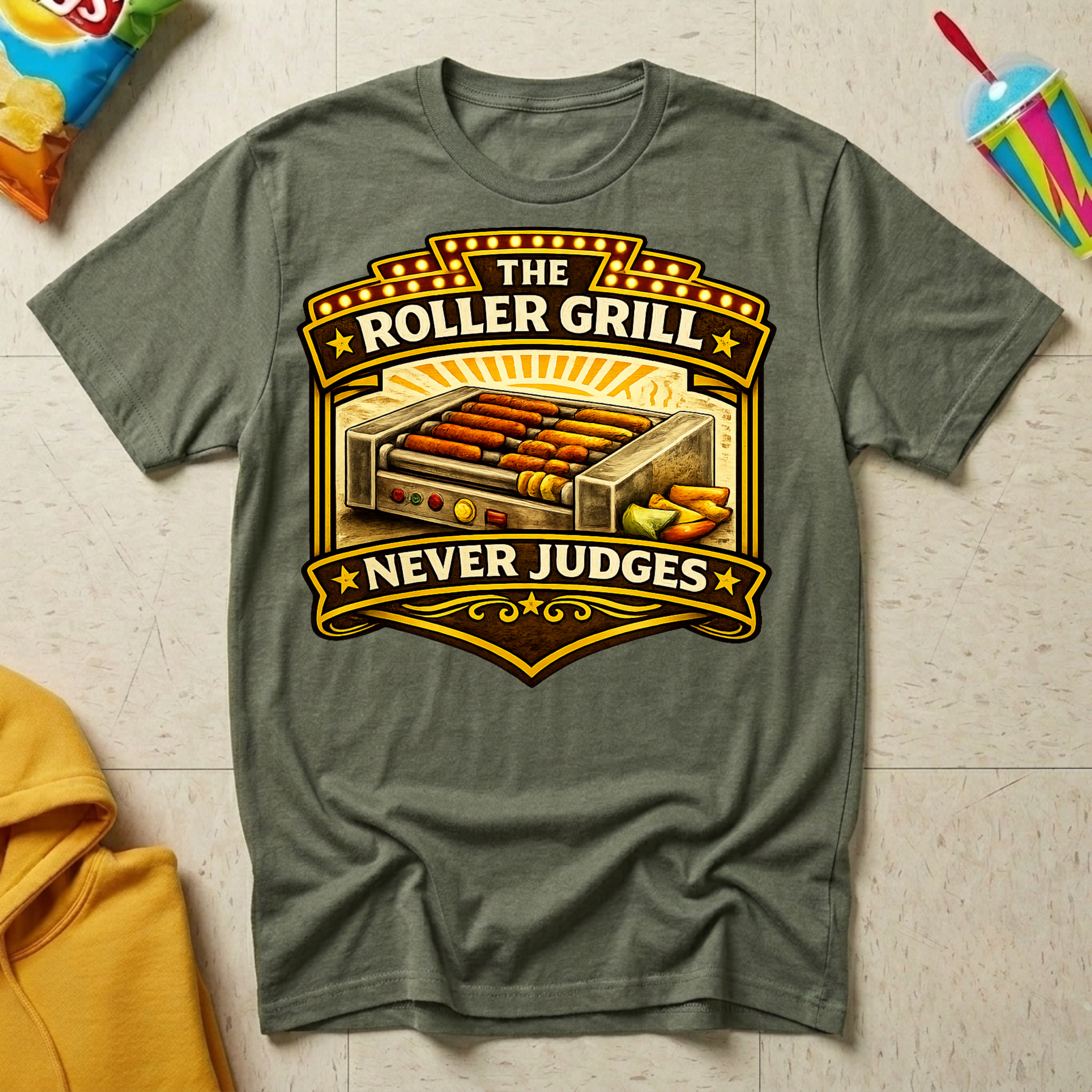 The Roller Grill Never Judges T-shirt by The Riverstone Life on a military green Gildan Softstyle 64000 featuring humorous truck stop roller grill food design. 