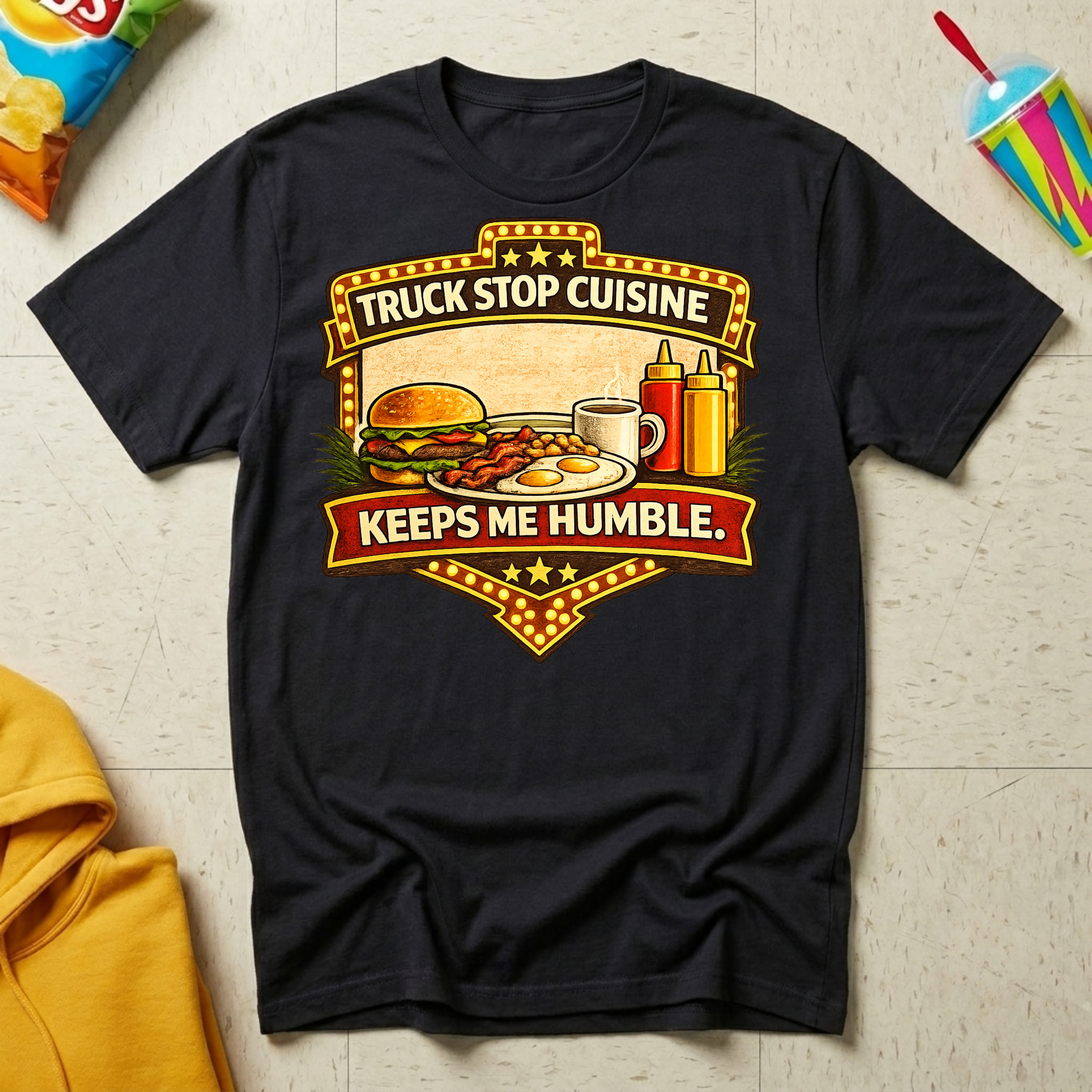 Truck Stop Cuisine Keeps Me Humble T-shirt by The Riverstone Life on a black Gildan Softstyle 64000 featuring a vintage truck stop food graphic.