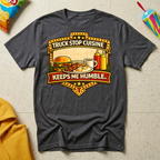 Truck Stop Cuisine Keeps Me Humble T-shirt by The Riverstone Life on a dark heather Gildan Softstyle 64000 featuring a vintage truck stop food graphic.