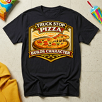Truck Stop Pizza Builds Character T-shirt by The Riverstone Life on a black Gildan Softstyle 64000 featuring a humorous truck stop pizza design.