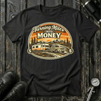 Turning Miles Into Money T-Shirt by The Riverstone Life on a black Gildan Softstyle 64000 featuring a pickup truck hauling an RV through a mountain landscape.