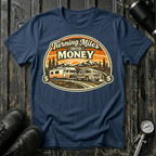 Turning Miles Into Money T-Shirt by The Riverstone Life on a navy Gildan Softstyle 64000 featuring a pickup truck hauling an RV through a mountain landscape.