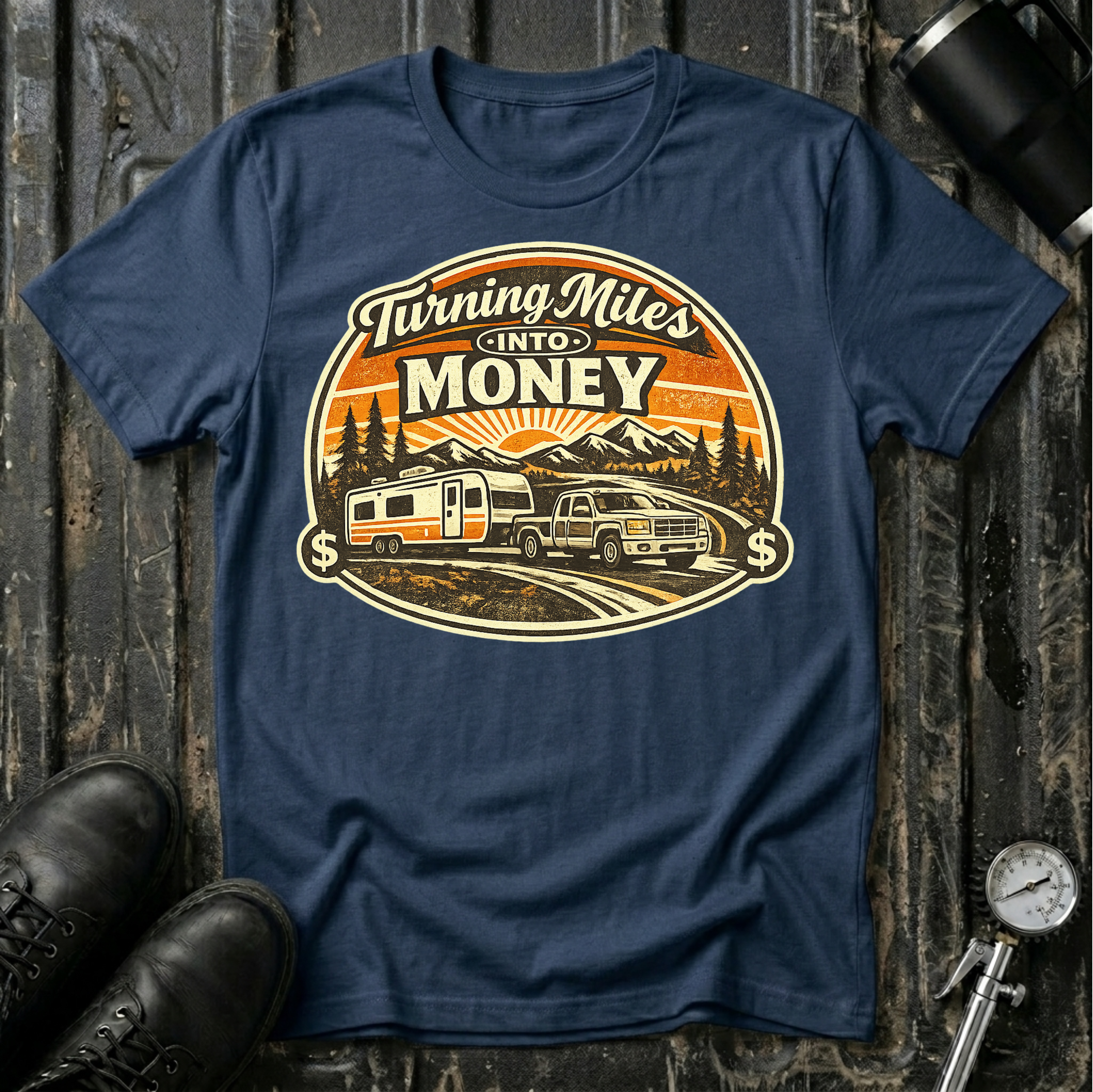 Turning Miles Into Money T-Shirt by The Riverstone Life on a navy Gildan Softstyle 64000 featuring a pickup truck hauling an RV through a mountain landscape.