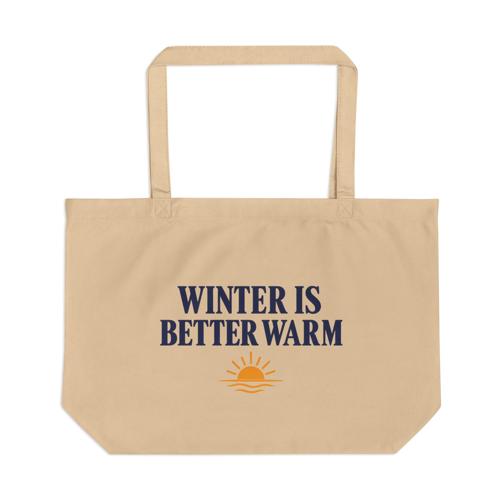 A beige canvas tote bag with the text 'WINTER IS BETTER WARM' in navy blue and a small orange sun graphic below, shown on a plain white background.